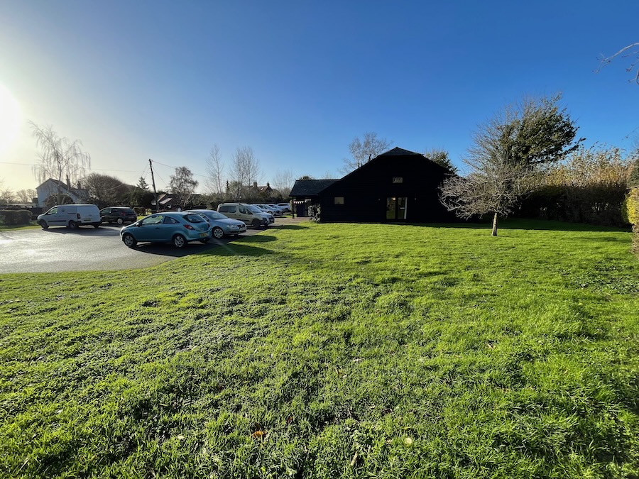 Brooklands Village Hall & field from right